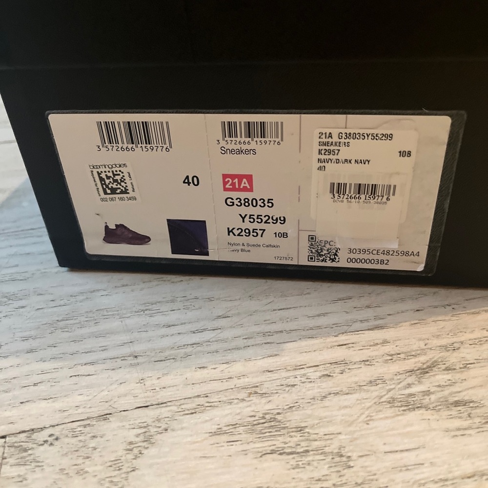 Empty Chanel sneaker shoe box with instructions booklet